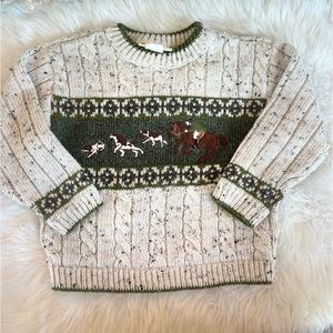 Adorable unisex cable knit sweater with embroidered fox hunting scene.